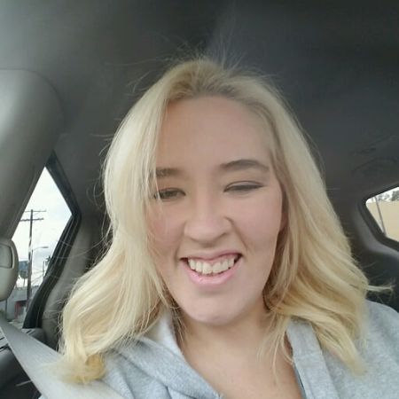 Mama June Shannon poses a picture inside her car.